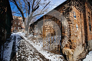 Old houses on low-rise street in old poverty part of Rostov-on-Don city in Russia