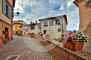 Old houses and narrow street. Barolo, Italy. photo