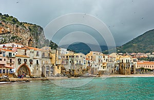 Old houses by the sea in Cefalu in Sicily