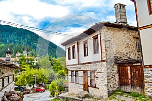 Old houses of Shiroka Laka Rhodopes mountain village Bulgaria photo