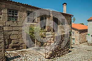 Old houses and stone staircase on cobblestone alley