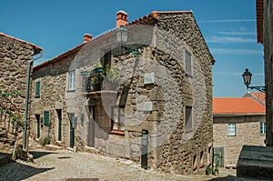 Old houses with stone wall and small balcony in Monsanto