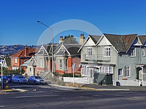 Old houses on a street in Dunedin in the Otago region of the South Island of New Zealand