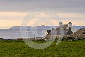 Old houses in Thurso, Scotland, with a view on the Orkney Islands