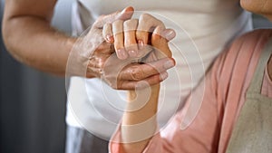 Old husband holding wife hand, spouse care and support, love connection, couple