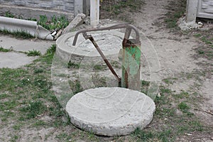 Old hydrant and two concrete hatch covers