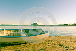 Old image clinker dinghy on beach