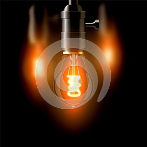 Old incandescent lamp, standard shape. On a dark background. Creates a cosiness.