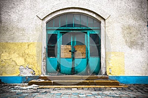 Old industrial building in a closed wooden door