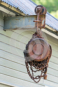 Old industrial chain hoist for reduce working load and lifting heavy object, mechanical hoist, gear hoist for one man operation