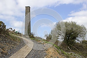 The old industrial chimney from the 19th century South Engine House at the derelict lead mines workings in Conlig in County Down,