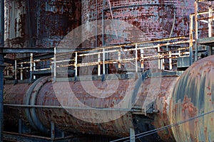 Old industrial complex scene with rusted peeling paint, decaying metal