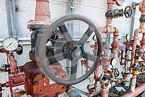 Old industrial fire extinguishing system now worn by time with manual valves