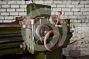 Old industrial machine tool. Rusty metal equipment in abandoned factory