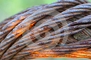 Old industrial rusty metal cable closeup. Metal  background