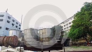 Old industrial storage tanks at soap manufacturing factory