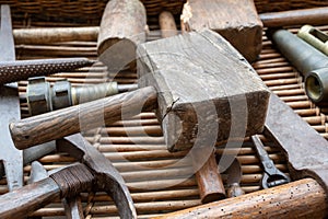 Old industrial wooden hammer and other manual ancient equipment for wine making industry in Champagne region, France