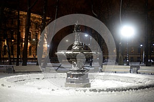 Old inoperative fountain at winter