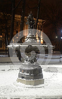 Old inoperative fountain at winter