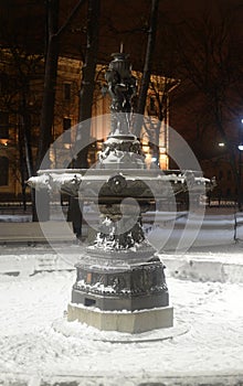 Old inoperative fountain at winter photo