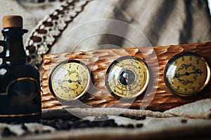 Old instrument of measurement - thermometer, barometer and hygrometer on a wooden frame