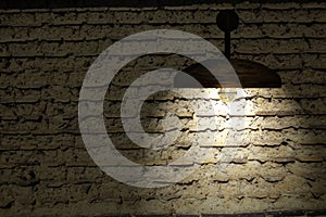 Old interior room with brick wall and three light spots