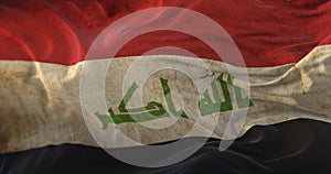 Old Irak Flag waving at wind photo