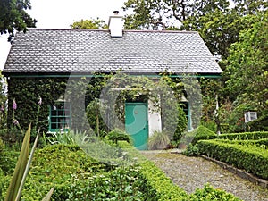 Old Irish Thatch Cottage in a village in Ireland photo