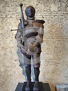 Old Iron armor of medieval knight with a big sword