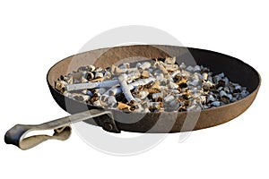 An old iron ashtray full of cigarette butts. Isolate on a white background