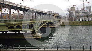Old iron bridge crossing the Sena river in Paris photo