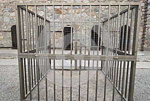 Old Iron Cell Bars and Stone Wall in Courtyard of Famous Yuma Territorial Prison State Historic Park