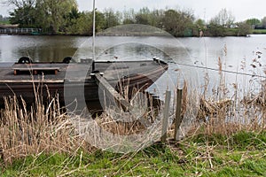 Old iron freighter moored in a river