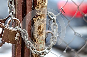 The old iron gate is locked with a chain. Breaking and entering private property. Closed Secret Zone