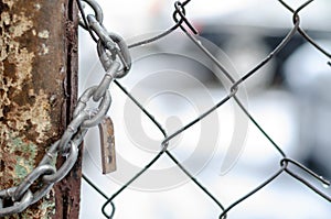 The old iron gate is locked with a chain. Breaking and entering private property. Closed Secret Zone