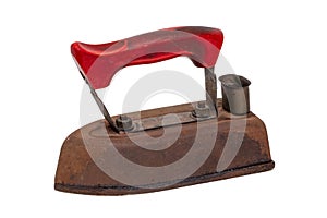 Old iron isolated. Close-up of a professional old rusty electric tailor iron or flatiron with a red handle isolated on a white