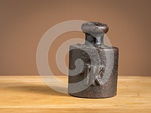 Old iron 1kg weight for a kitchen scale photo