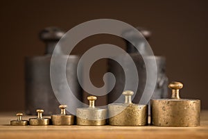 Old iron 1kg weights and smaller brass weights for a kitchen scale