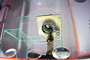 Old iron microscope with magnifying lenses