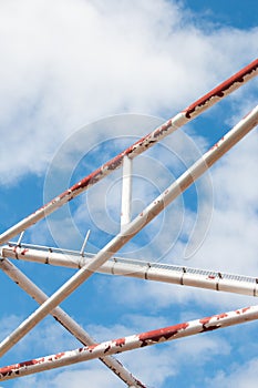 Old iron pole on sky background