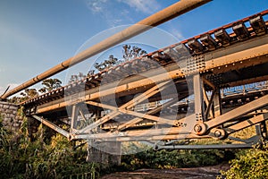 Old iron railway bridge in a rural area in the afternoon