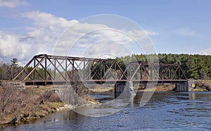 An Old iron railway truss bridge crossing the Mississippi river in spring in Galetta, Ontario, Canada