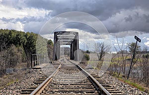 An Old iron railway truss bridge crossing the Mississippi river in spring in Galetta, Ontario, Canada