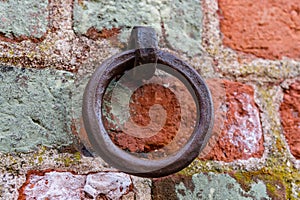 Old iron ring mounted in a brick wall