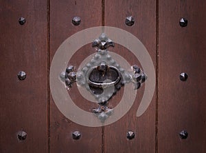 The old iron ring on a wooden door