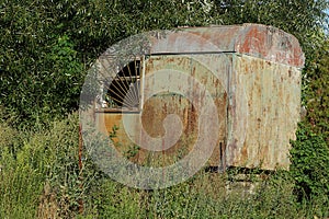 Old iron trailer in rust with a window
