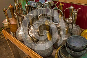 Old iron utensils. Old metal jugs