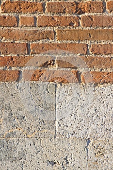 Old italian brick and bright stone wall after an architectural r