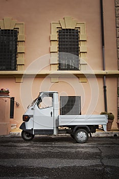 Old Italian car parked in a historic building