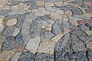 Old italian paving built with irregularly shaped stone blocks called opus incertum